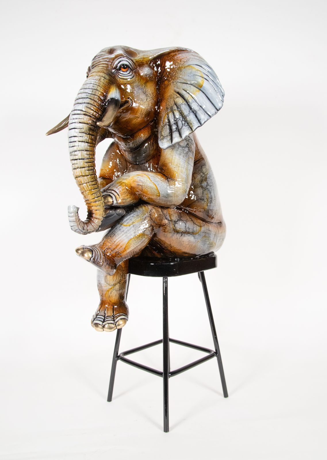 Signed, limited edition bronze elephant on stool sculpture by Carlos & Albert